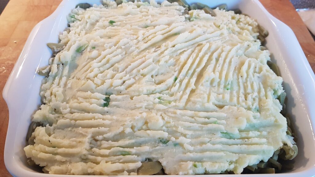 en de laatste laag aardappelpuree